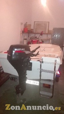 BARCA RIGIDA CON MOTOR Y REMOLQUE